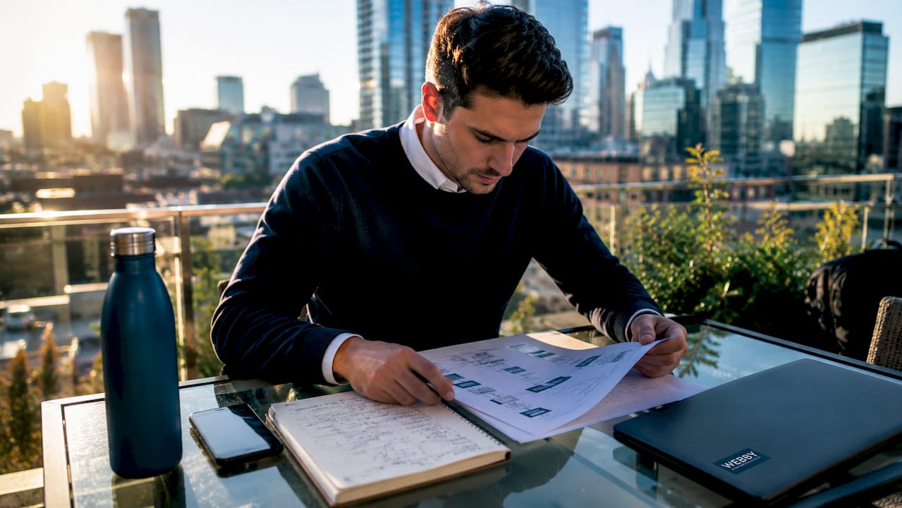 Marketing specialist reviewing URL sitemap at desk